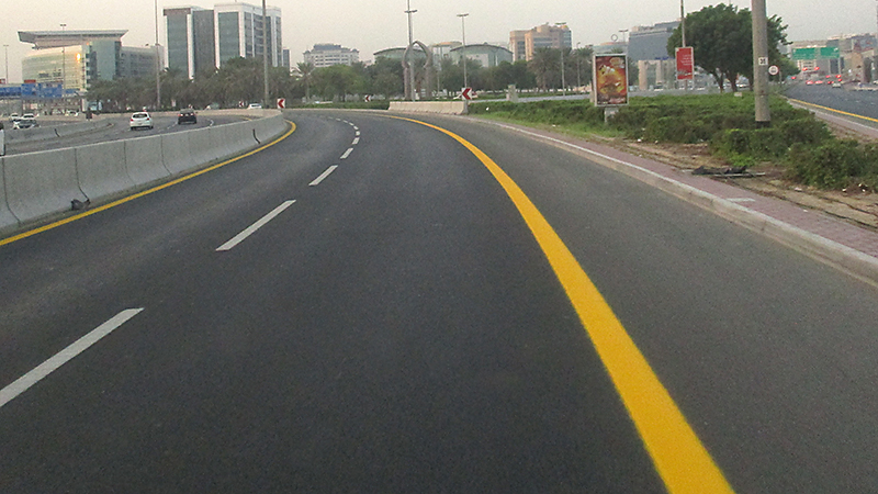 Road Surfaces Marking Showing Dotted White and Solid Yellow Lines